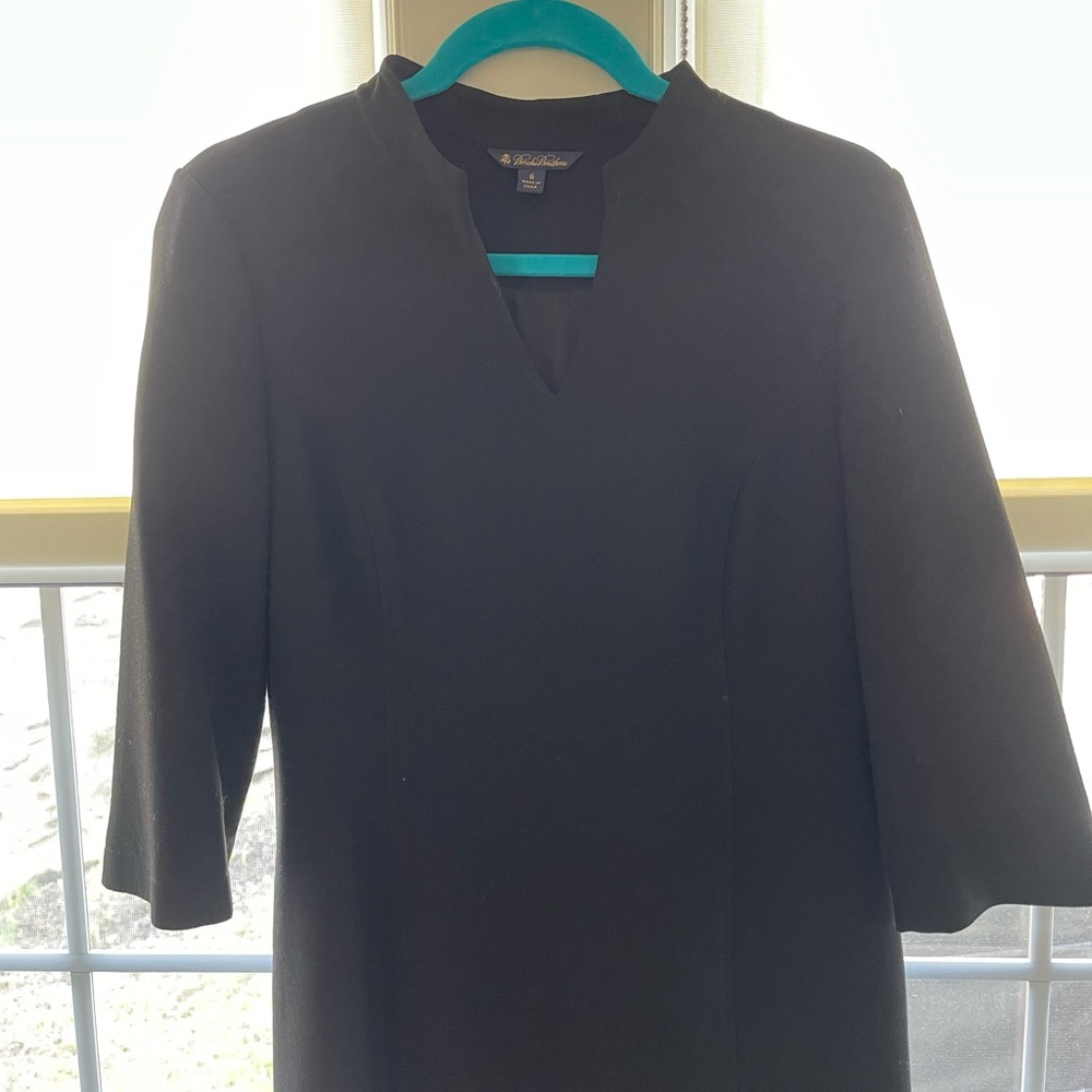 I am 5’4” and this knee length black Brooks Brothers dress is a classic fit.
